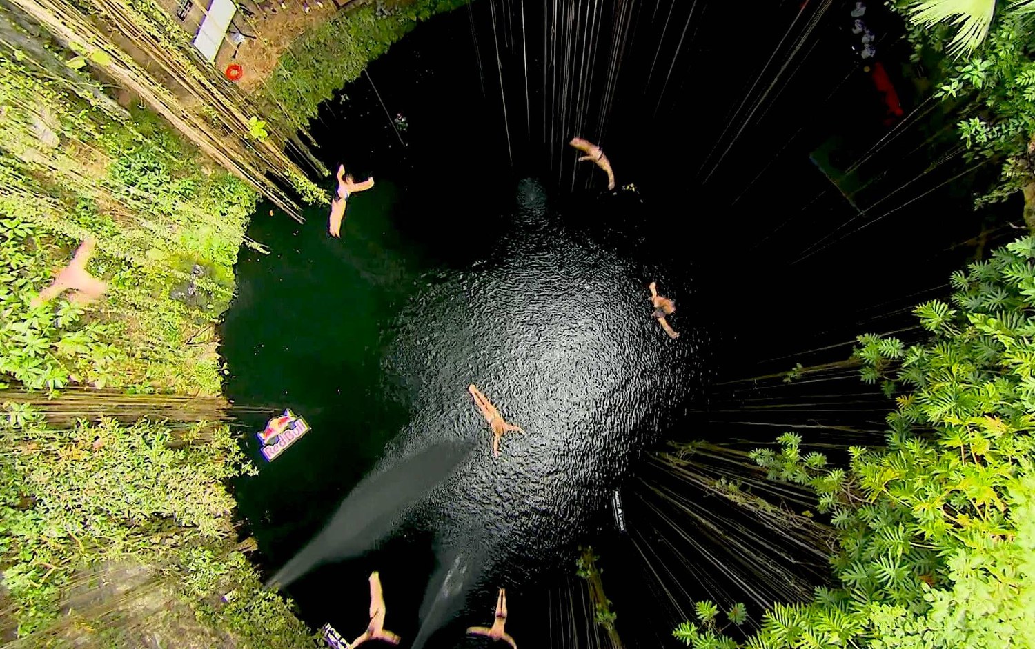 Group Cliff Dive into the Ik Kil Cenote